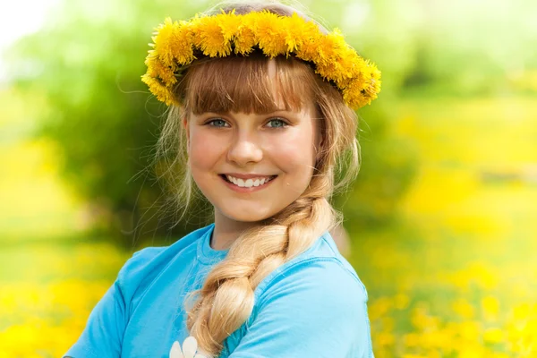 Girl with dandelion wreath — Stock Photo, Image