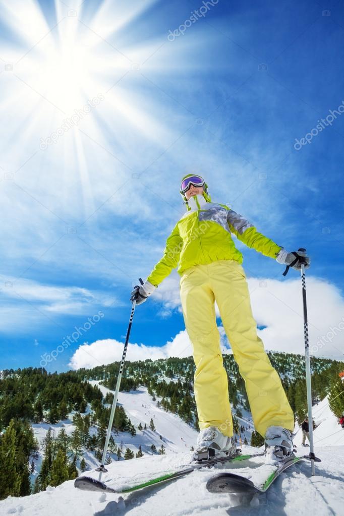 Happy skier on top of the mountain