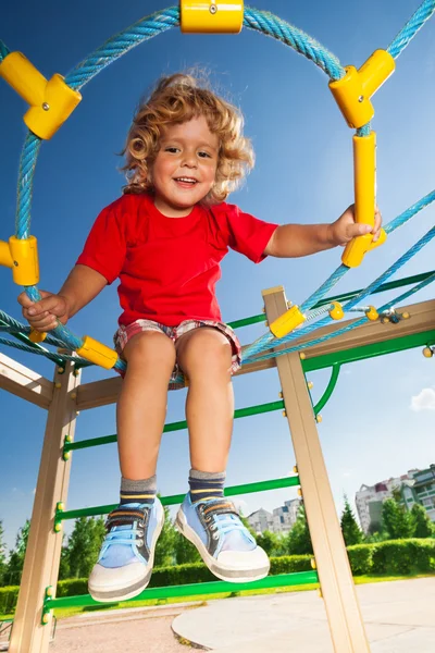 Boy in the web on playground — Stock Photo, Image