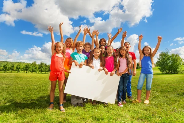 Many kids with white board — Stock Photo, Image