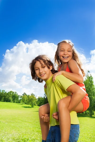 Girl ride on boy — Stock Photo, Image