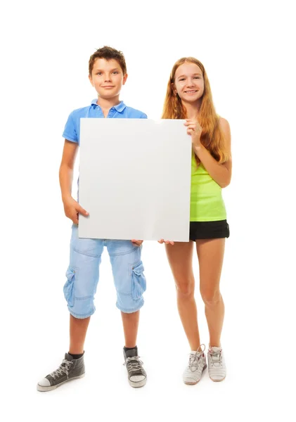 Boy and girl with sign — Stock Photo, Image