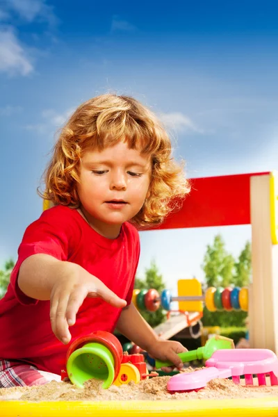 Sanbox and boy — Stock Photo, Image