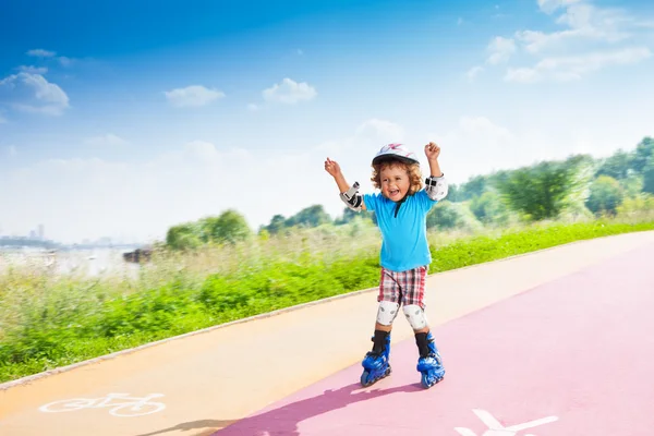 Happy boy with lifted hands — Stock Photo, Image