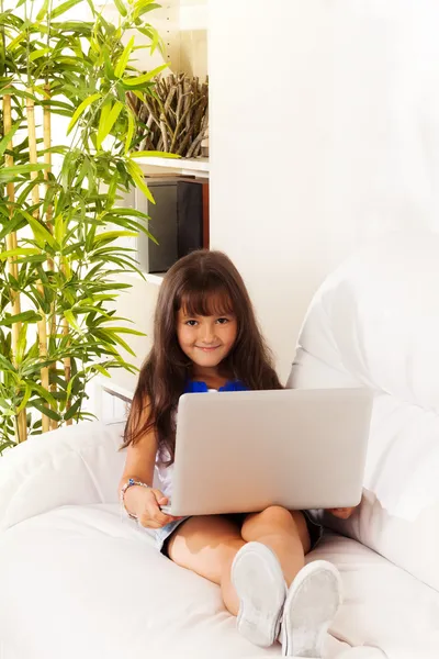 Long haired girl with laptop — Stock Photo, Image