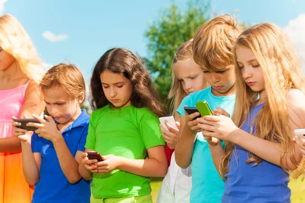 Group of kids sms — Stock Photo, Image