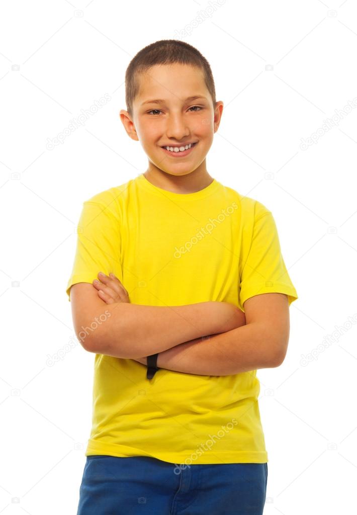 Confident boy in yellow shirt