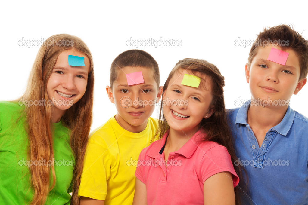 Four kids with stickers on forehead