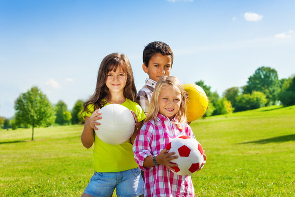 Happy kids with balls