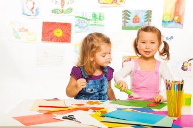Little girls with color paper clipart