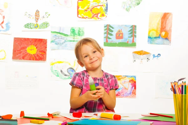 Smiling girl with glue stick — Stock Photo, Image