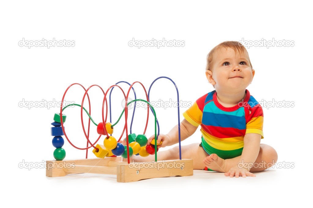 Toddler playing with developing toy