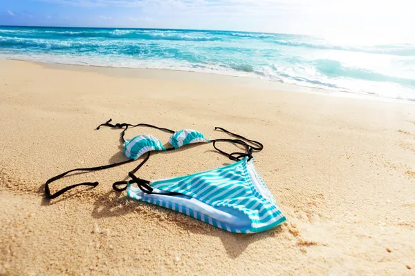 Bikini swimsuit on the beach — Stock Photo, Image