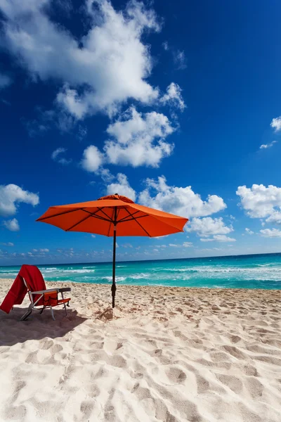 Orange umbrella and chair — Stock Photo, Image