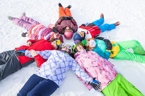 Happy friends lying in a circle — Stock Photo, Image