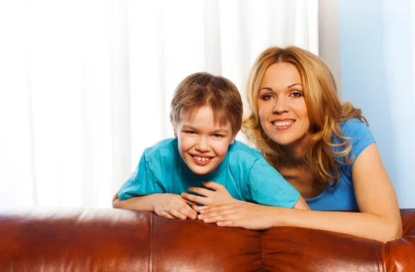 Boy and his mother cuddling each other Stock Image