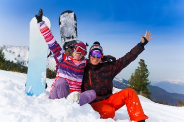Couple with snowboards clipart