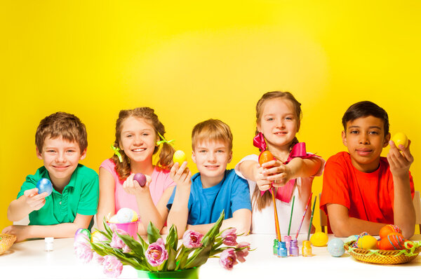 kids holding  Easter eggs