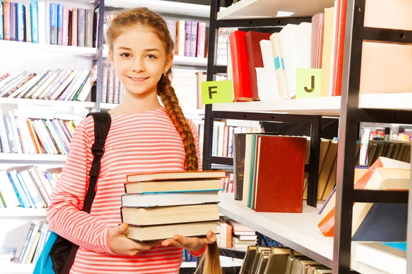 Girl holds books — Stock Photo, Image