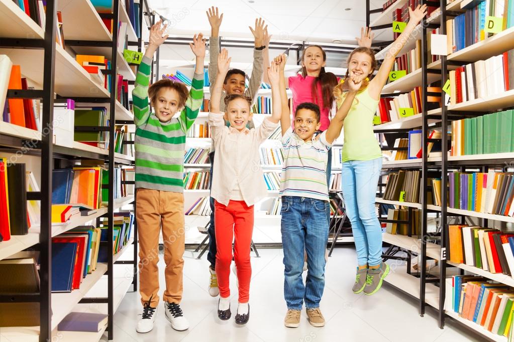 kids jumping  in  library