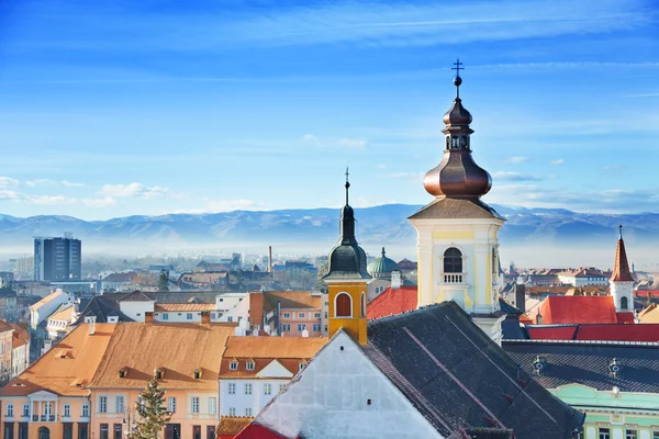 Roman Catholic Church and old town in Sibiu — Stock Photo, Image