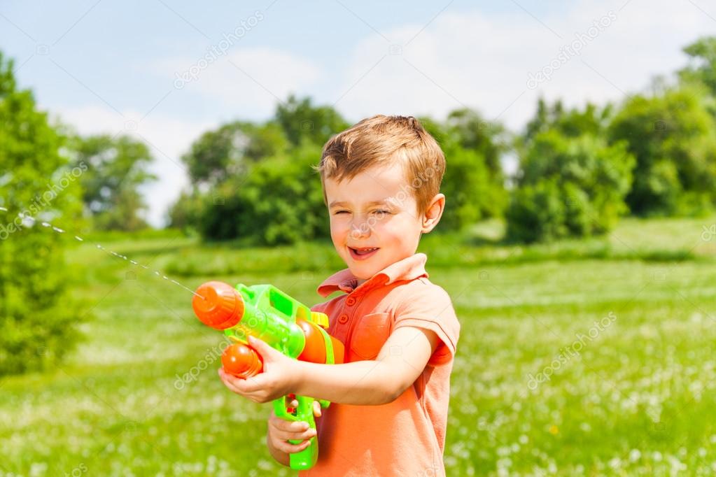 Boy with a water gun