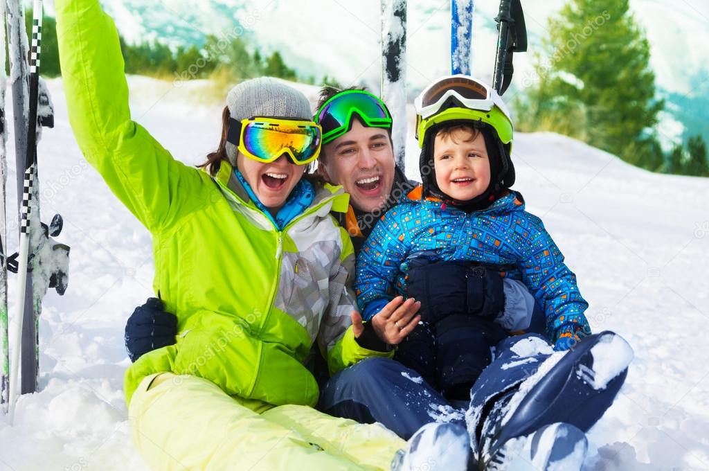 Family sitting on snow