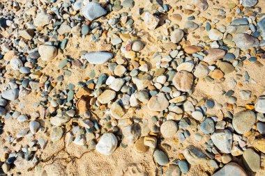 Elements stone pebbles and sand background texture view from above clipart