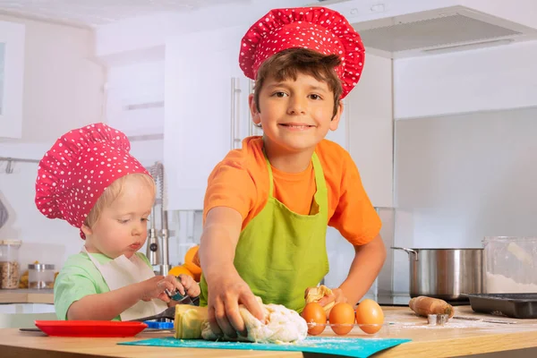 Boy Takes Dough Cook Kitchen Little Brother — Stock Photo, Image