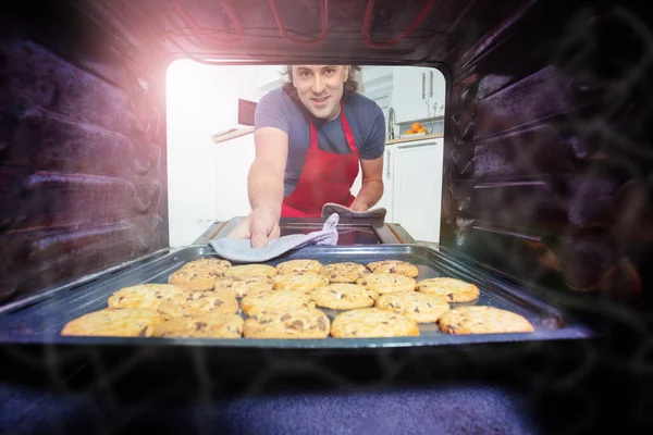 Man Red Apron Take Tray Cookies Using Oven Glove Out — Stock Photo, Image