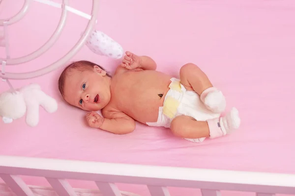 Portrait Little Newborn Baby Girl Lay Pink Crib View Mobile — Stockfoto
