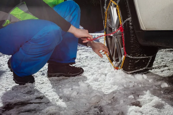 Close Man Putting Winter Chains Car Wheel Snow Road Ice — 图库照片