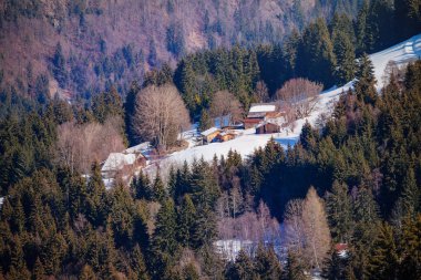 French mountain landscape many different chalets on Alps slope at winter