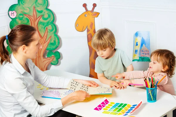 Woman Kindergarten Teach Children Boy Girl Read Letters Early Development — Fotografia de Stock