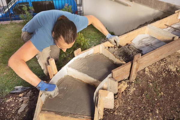 Man Filling Formworks Concrete Staircase Home Using Trowel Doing Diy — Stock Photo, Image