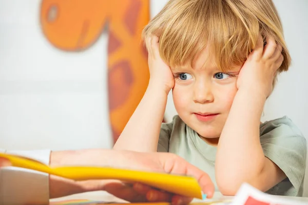 Kindergarten Development Lesson Little Blond Boy Thoughtful Expression Look Page — Stock fotografie