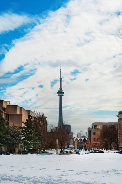 Toronto typical neighborhood houses at winter and view of CN Tower