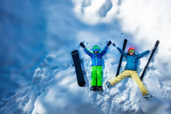 Mother Boy Lay Snow Ski Sport Helmets View Lifting Hands — Zdjęcie stockowe