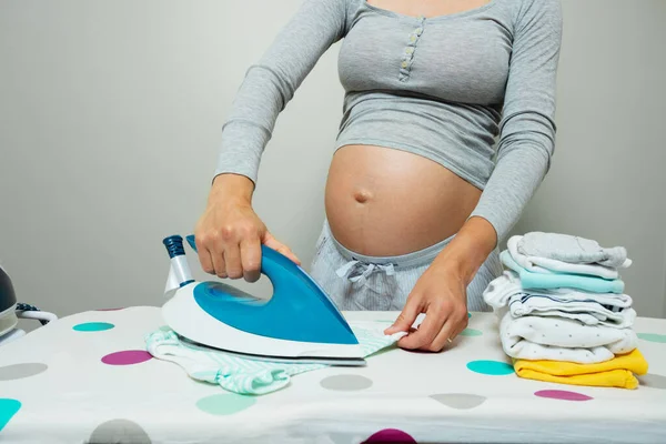 Close Pregnant Woman Ironing Newborn Baby Clothes Preparing Birth Child — 스톡 사진