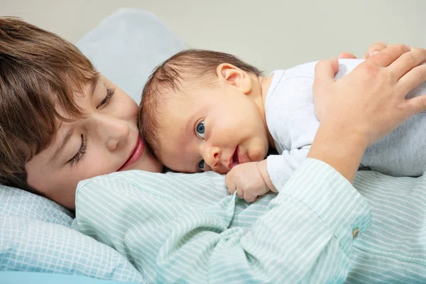 Close Portrait Calm Happy Boy Lay Bed Hugging Newborn Sister — Stok Foto