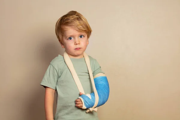 Calm Little Blond Boy Having Broken Hand Cast Look Camera — ストック写真