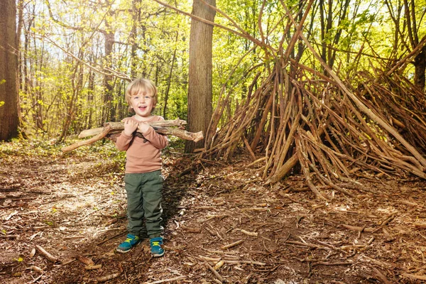 Boy Pile Brushwood Forest Build Hut Branches Happy Laughing — Foto Stock