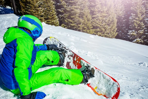 Young Boy Attaching Snowboard Sitting Snow Ski Track — ストック写真