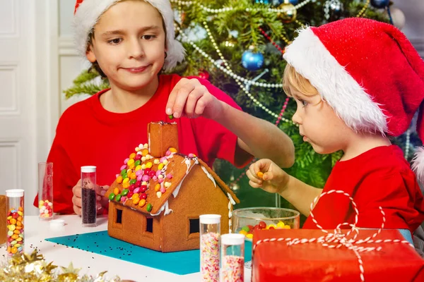 Two Little Young Sibling Boys Glue Chimney Gingerbread House Sitting — Stock Photo, Image