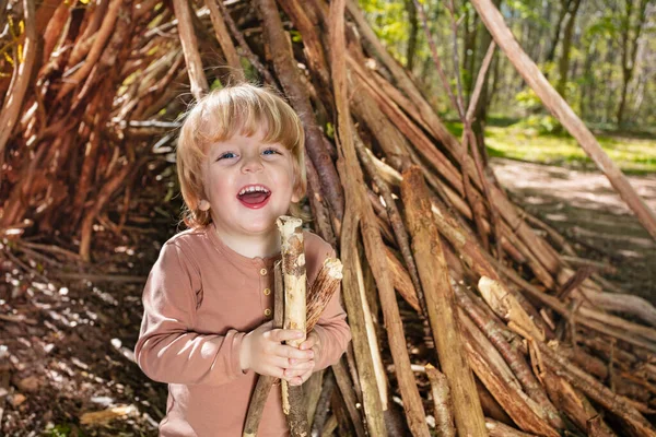 Close Portrait Little Boy Pile Brushwood Forest Hut Branches Laughing — 图库照片