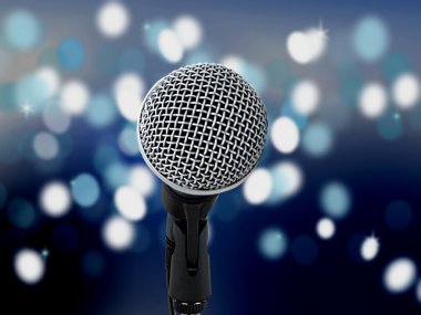 Arka planda bulanık ışıklar olan mikrofon