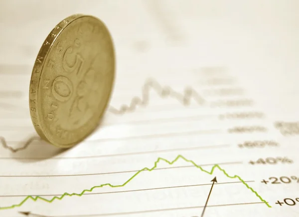 Coin on stock chart — Stock Photo, Image