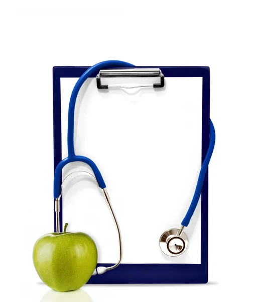 Stethoscoop en groene appel — Stockfoto