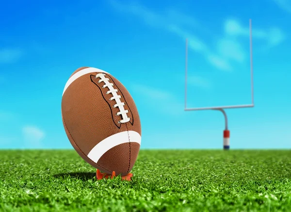 Football Ball on Kicking Tee with Goal Post — Stock Photo, Image