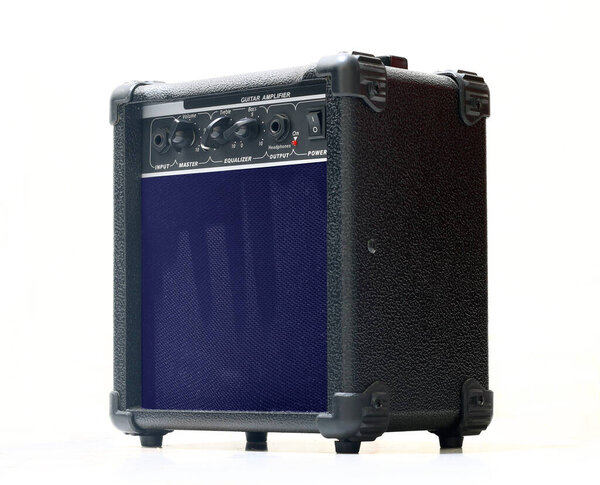 Electric guitar amplifier in close up over white background